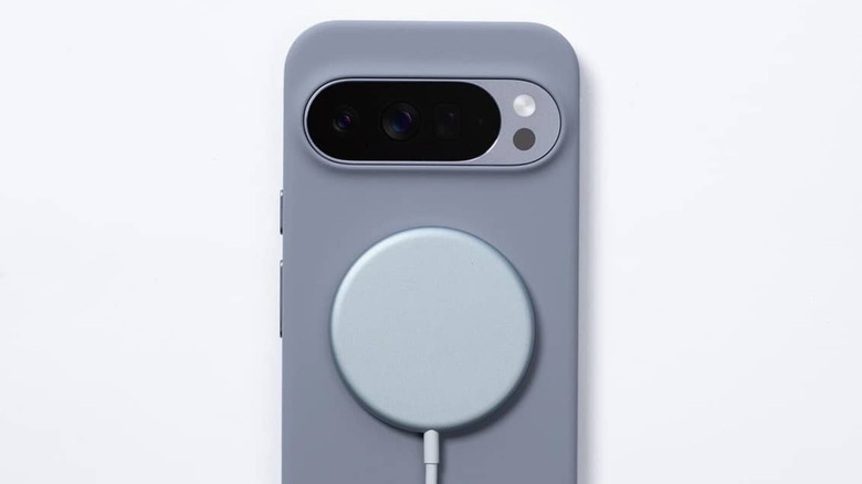 Google Pixel phone with a PixelSnap magnetic charger attached to the back.