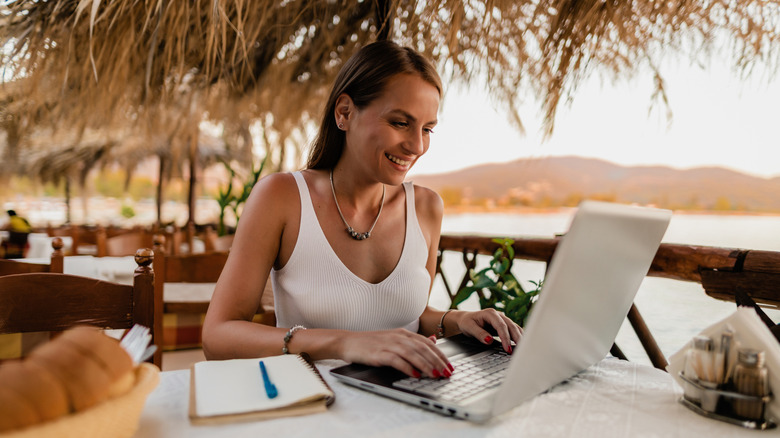 person emailing on laptop