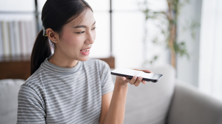 person talking with chatbot on phone