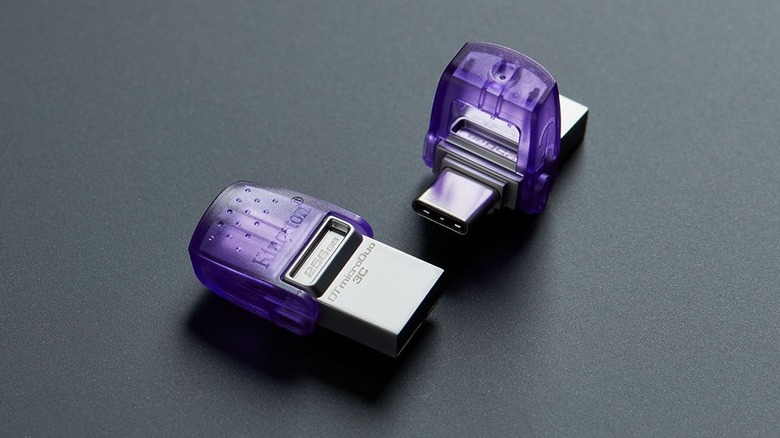 Close-up of two Kingston DataTraveler microDuo 3C drives on a grey surface