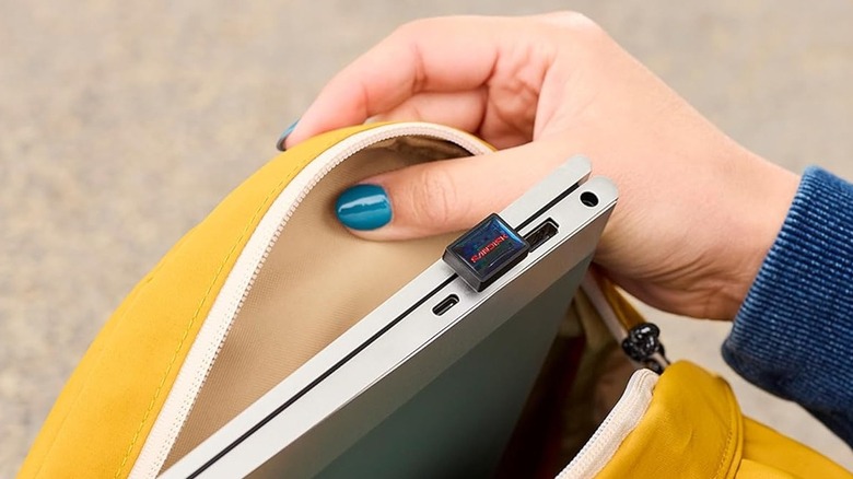 Close-up of Sandisk Extreme Fit USB-C Flash Drive plugged in to a laptop that's placed in a backpack