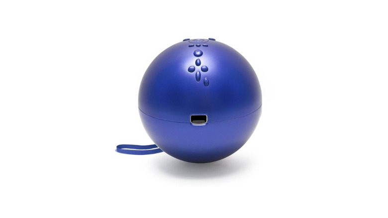 A Wii Remote inside a blue bowling ball enclosure