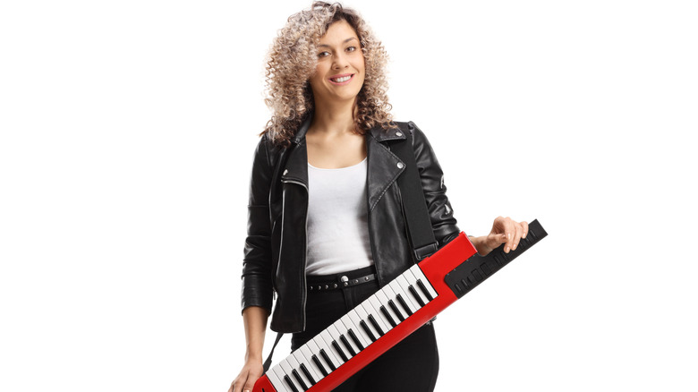 Person holding keytar
