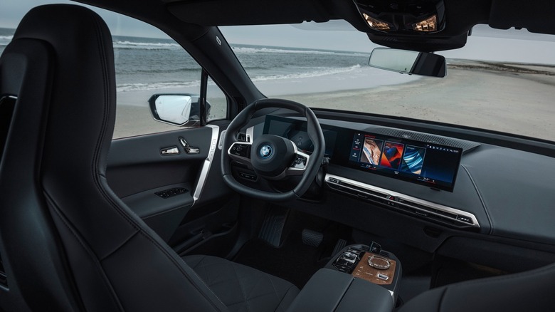 Interior of a BMW iX parked by the beach.