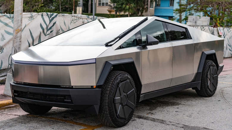 Tesla Cybertruck parked on a residential street.