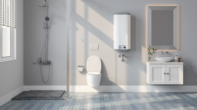 A modern looking bathroom with gray walls, there is a shower, toilet, sink and mirror that can be seen