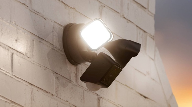 The Wyze Cam Floodlight v2 mounted on an exterior wall of a house