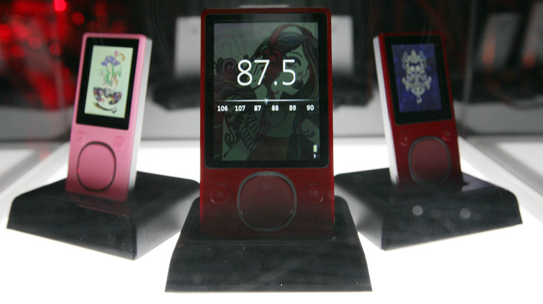 A trio of Zunes on display.