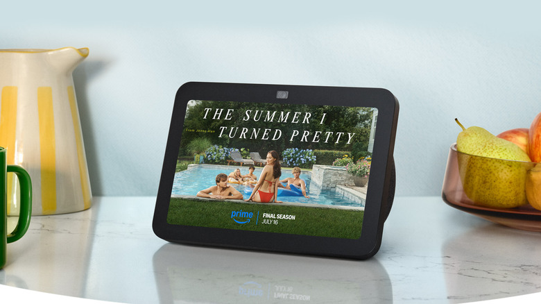 Amazon Echo Show displaying "The Summer I Turned Pretty" poster on a kitchen counter.