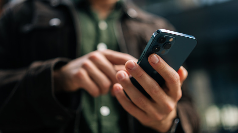 A man using an iPhone