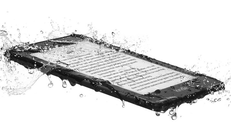 Kindle Paperwhite 4 splashing through water with a book page open on the screen.