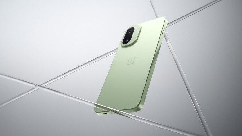 Green OnePlus 15R on rendered gray background
