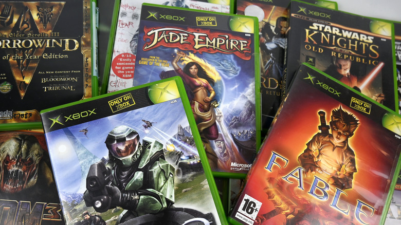 A number of original Xbox games in cases