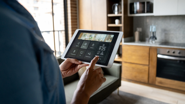 A person upgrading smart home gadgets in their house