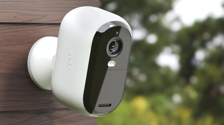 The Arlo Essential Security Camera mounted to exterior siding.
