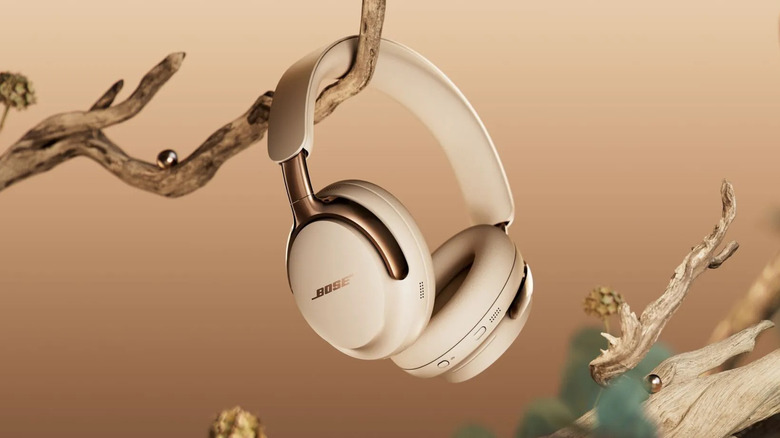 Bose QuietComfort Ultra Headphones (2nd Gen) hanging from a branch.