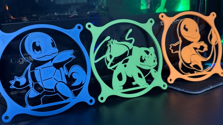 From left to right: 120 mm fan covers featuring the Pokemon Squirtle, Bulbasaur, and Charmander.