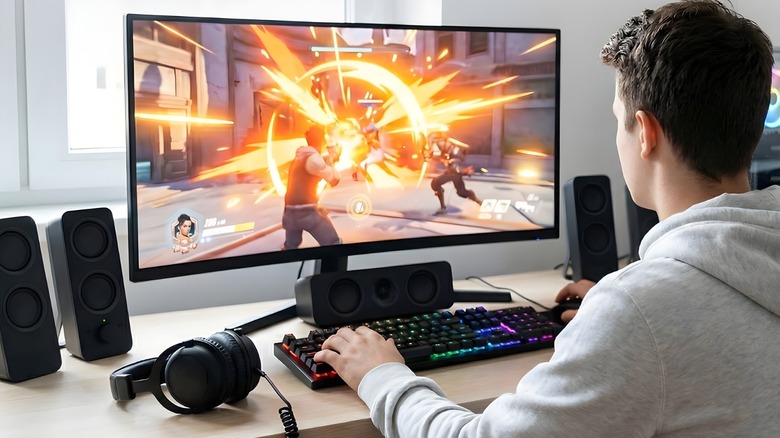 A gamer using a 5.1 surround sound system with Creative Sound Blaster Audigy Fx Pro sound card