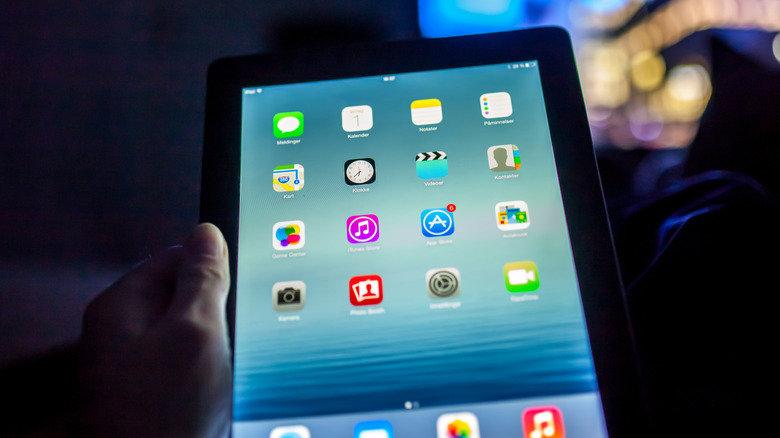 Person using a tablet in a dark room