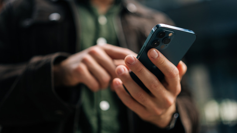 iPhone in a user's hand