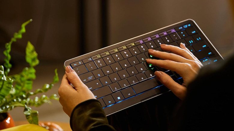 A person using the Clevetura CLVX S keyboard in their lap