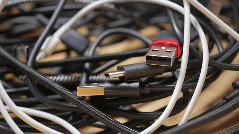 A tangle of various cables for electronic devices