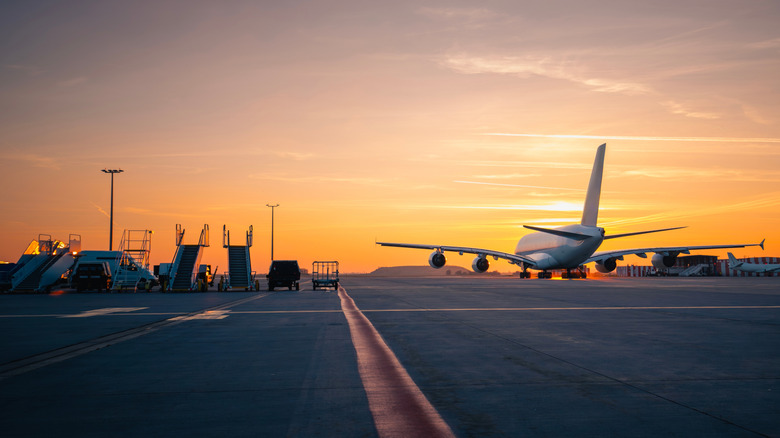 A passenger airplane on an airport runway.