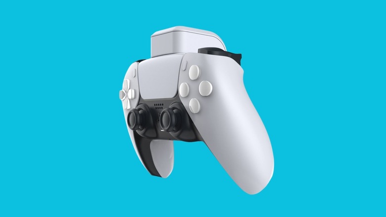 White PS5 DualSense controller with a clip-on battery attached to the top.