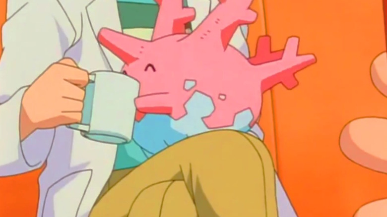 a Pokémon professor letting Corsola sip a cup