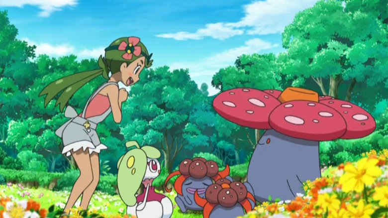 a trainer onlooking several plant Pokémon like Vileplume
