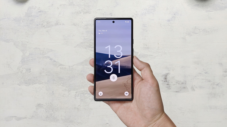 A hand holding a Google Pixel 6