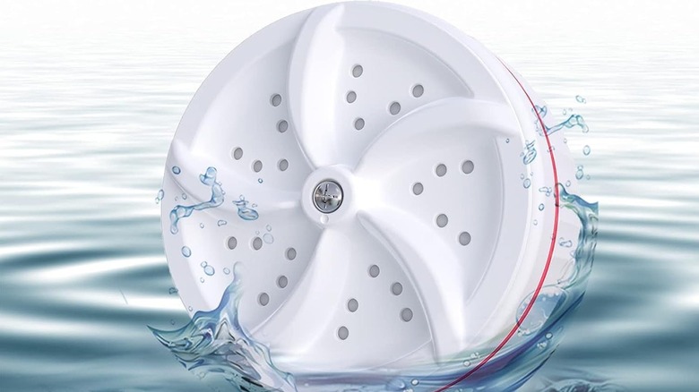 Portable washing machine floating in water