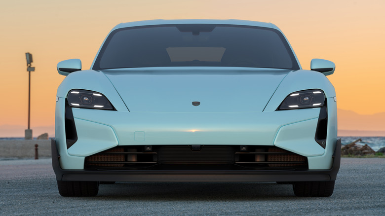 Porsche Taycan Turbo GT shown from the front at sunset.