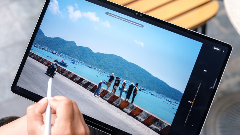 Samsung Galaxy Tab S10 Ultra being used with an S Pen for photo editing.