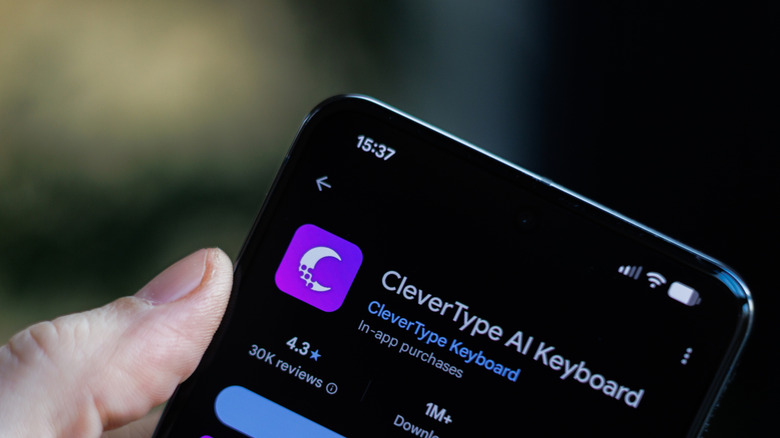 Phone in hand displaying CleverType AI Keyword app
