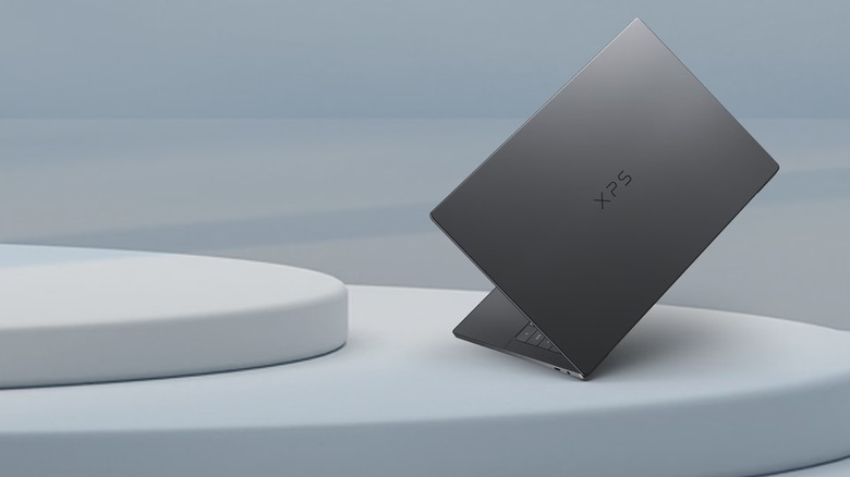Dell XPS 14 laptop resting at a sharp angle.