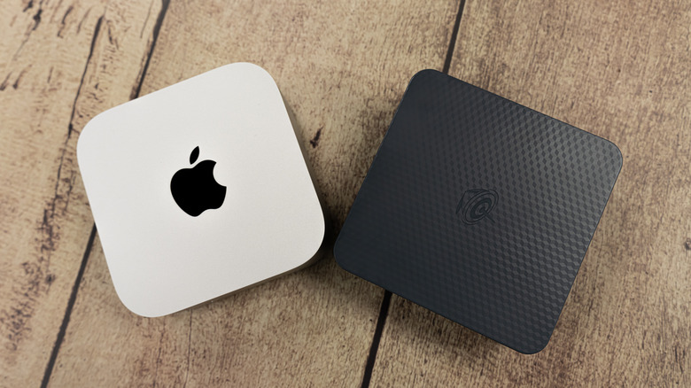 Mac mini next to a Windows mini PC