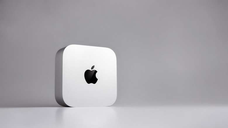 Mac mini M6 standing upright with the Apple logo displayed