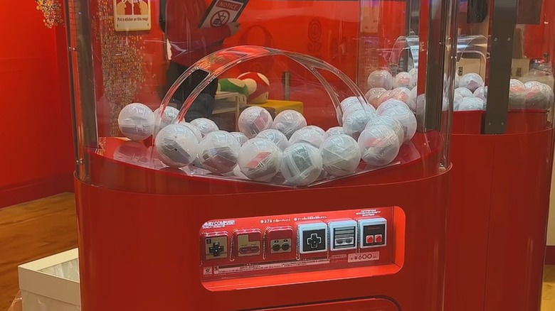 Gashapon machine with Nintendo controller fidget toys in Narita airport