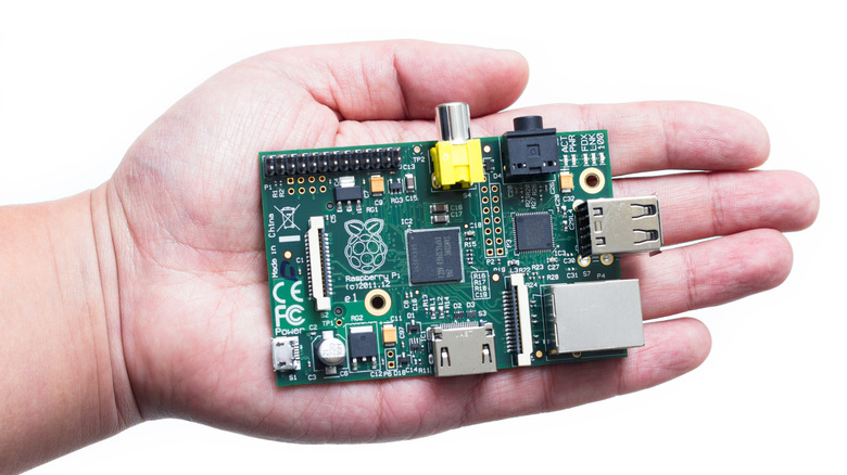 Hand holding a Raspberry Pi