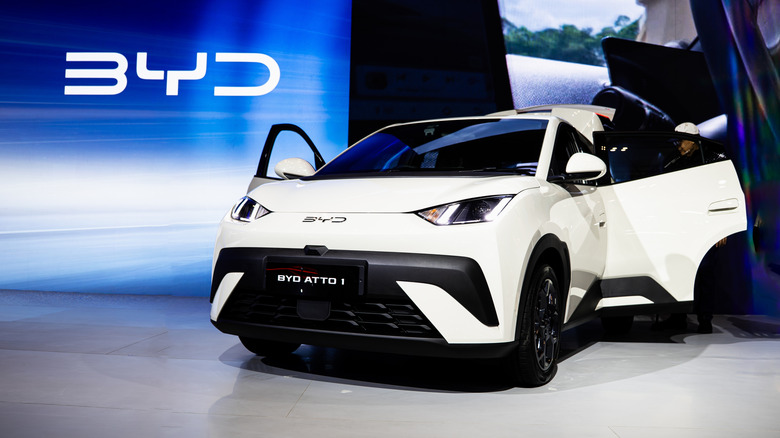 A BYD EV us revealed at a car show.