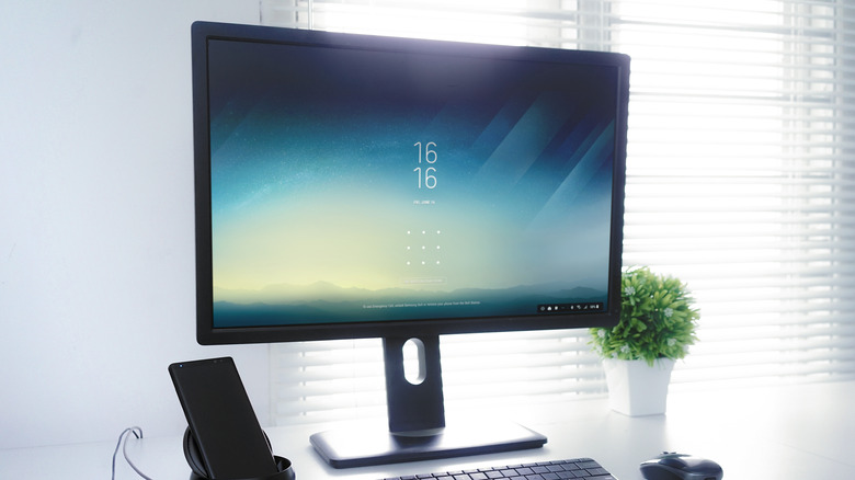 samsung smartphone using DeX desktop mode on a monitor
