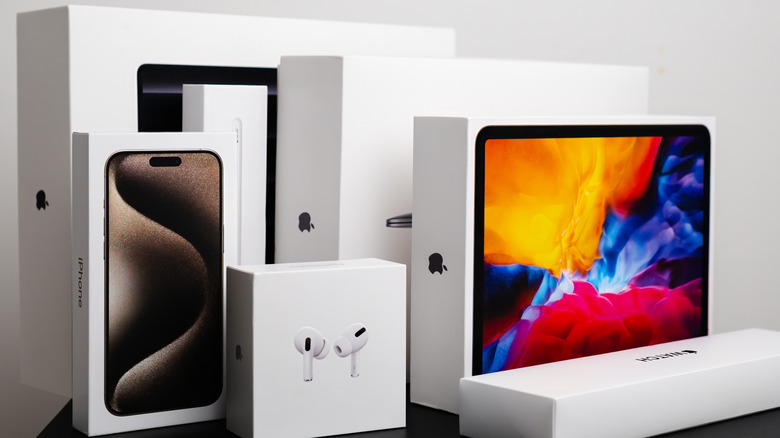 Retail boxes for various Apple products, including the iPhone and Apple Watch.