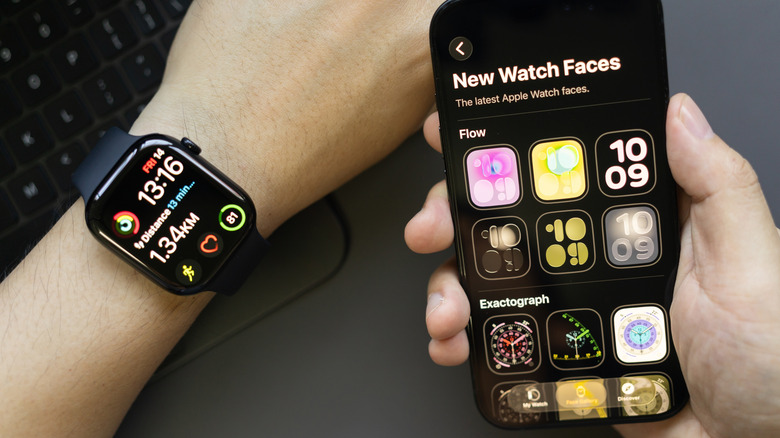A person customizing the Apple Watch appearance on an iPhone.