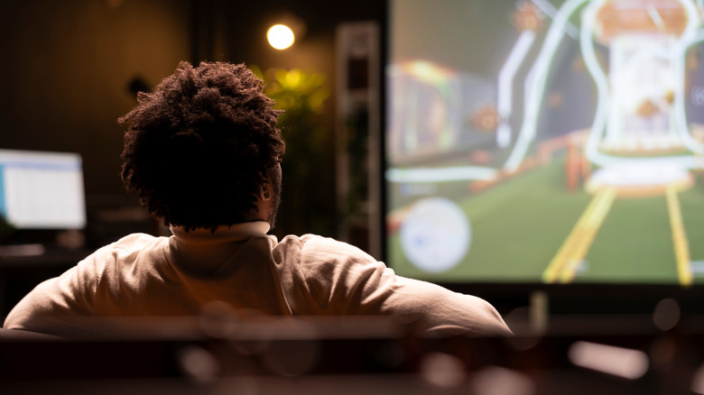 Watching a movie with the movie screen in the background