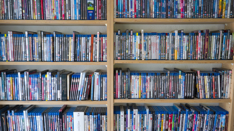 A set of shelves lined with Blu-ray and DVD movies