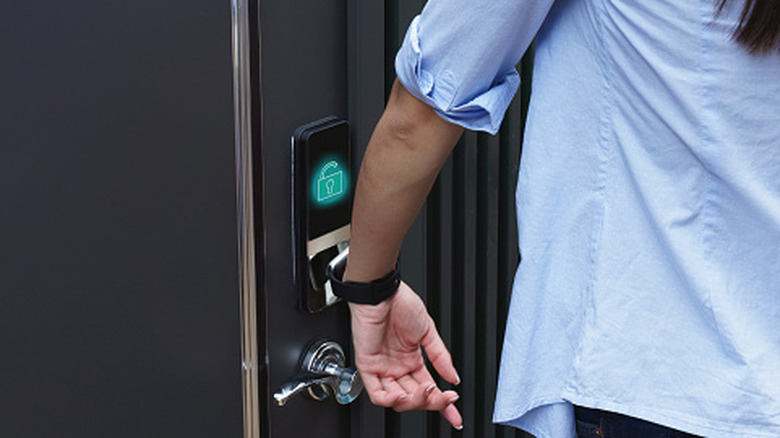 Someone scanning their smartphone to open a smart lock