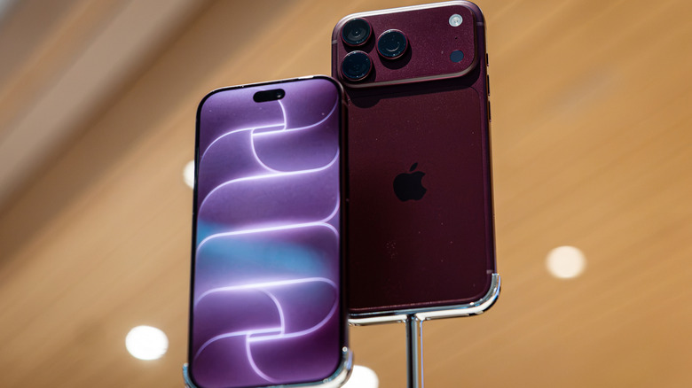 The iPhone 18 Pro (burgundy) on display in a store.