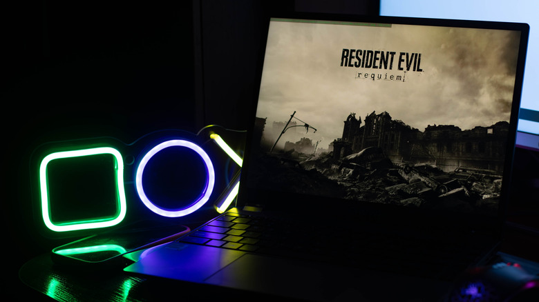 A laptop showing the splash screen from Resident Evil Requiem game