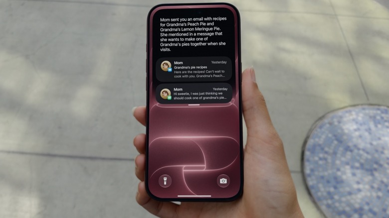 A hand holding the new iPhone 18 Pro with Siri AI on the screen
